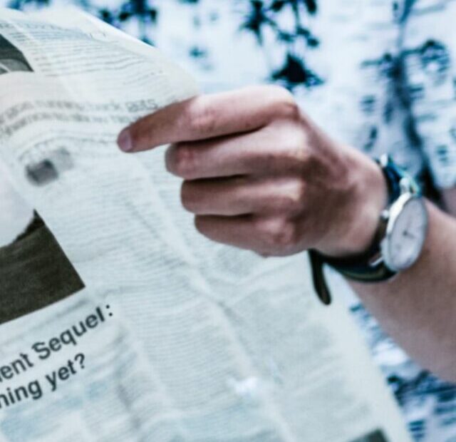 cropped-Man-reading-newspaper.jpeg