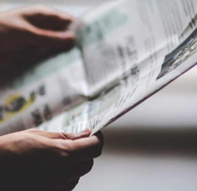 cropped-Man-with-newspaper.jpeg